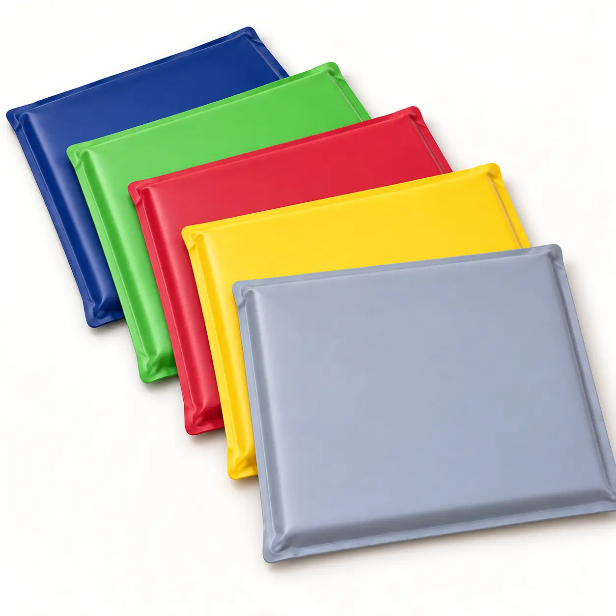 Tuffr-style veterinary pads shown in blue, green, red, yellow and gray